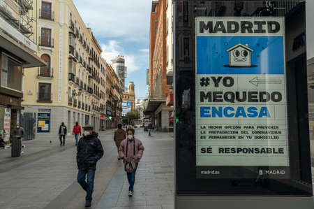 A few pedestrians walk down Preciados street, in Madrid's city center, following coronavirus lockdownのeditorial素材