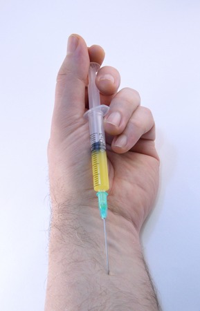 Injected medication using a disposable syringeの写真素材