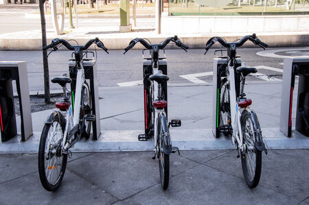 Three urban rental bikes parkedの写真素材