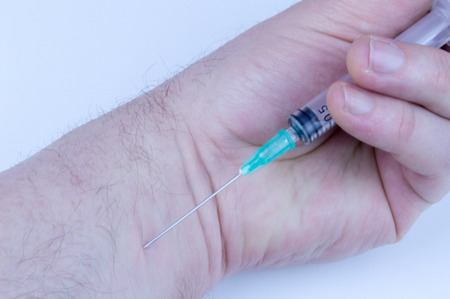 Disposable syringe ready for injectionの写真素材