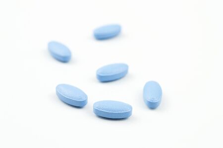 Blue tablets isolated on white backgroundの写真素材