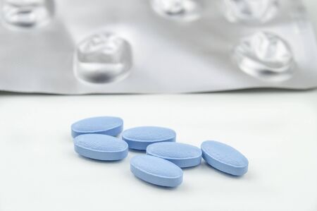 Blue tablets isolated on white backgroundの写真素材