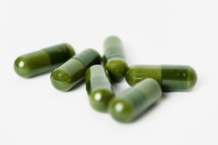 capsules in the pharmacy laboratory isolated on white backgroundの写真素材