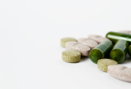 Tablets and capsules isolated on white background isolatedの写真素材