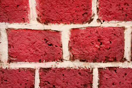 Red-Pink bricked textured wall backgroundの写真素材