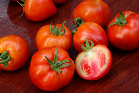 Tomatoes on wooden tableの写真素材