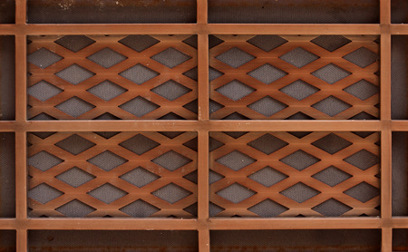 wooden lath with a grid of thin strips の写真素材