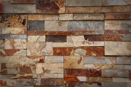 Grey, white and brown granite brick wall and black vignette