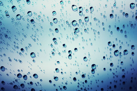 raindrops on glass, abstract backgroundの写真素材