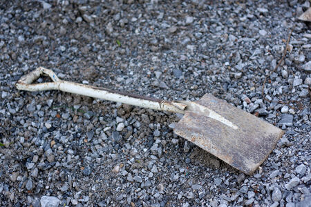 rusty shovel on gravel の写真素材