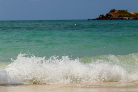 Wave of the sea on sandy beach.