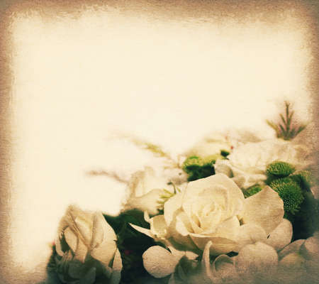 Vintage postcard with copy space, white roses bouquets, soft light on old paper texture style image.の写真素材