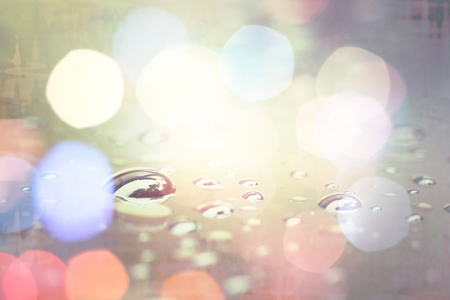 Water drop with light bokeh, rainy season abstract background.の写真素材