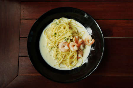 White cream sauce spaghetti with shrimp.の写真素材