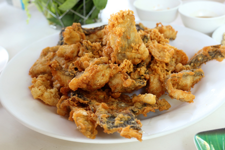 Deep fried fish served with vegetable.の写真素材