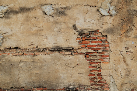The old cracked wall of the abandoned ruins.の写真素材