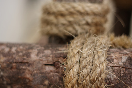 Abstract background of blurred rope wrapped around log.の写真素材