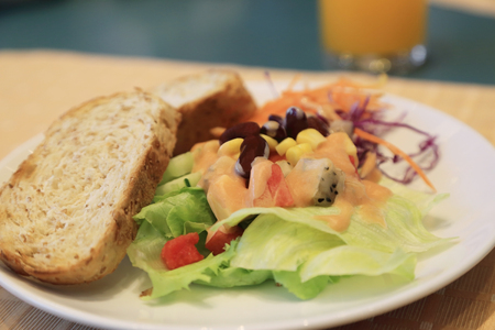 Healthy breakfast, Fresh vegetable and fruits salad with toast.の写真素材
