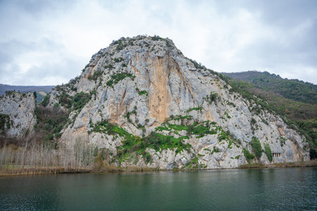 Rocky cliff with ancient rock tombs of Asarkale in Bafra, Samsun, Turkey. Historical ancient columns carved into the rock. Tourist attractions, tour destinationsの写真素材
