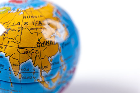 Globe of the world on white background. European and Asian continents on colorful earth globe, close-upの写真素材