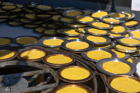 Traditional Turkish and Arabic dessert knafeh, kunefe. Delicious kunafa on copper tray plates....