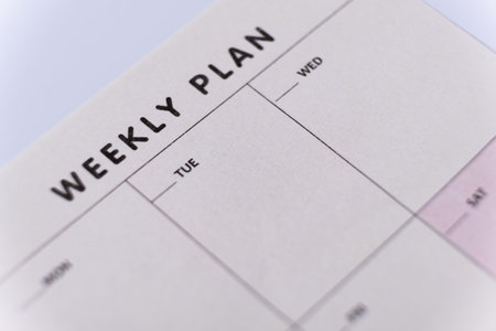 Weekly planner. Calendar reminder, organizer, schedule, planning concept. Close-up of weekly plan paperの写真素材