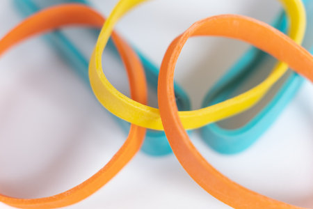 Rubber bands on a white background. Many colorful plastic rubber bands. Close up viewの写真素材