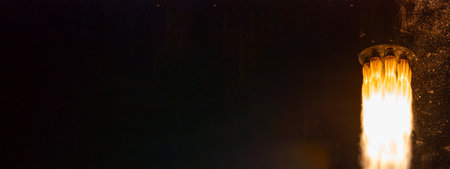 Rocket launch on dark background. Space shuttle rocket launch concept wallpaper.の写真素材