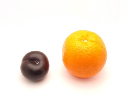 Orange and plum on a white background        の写真素材