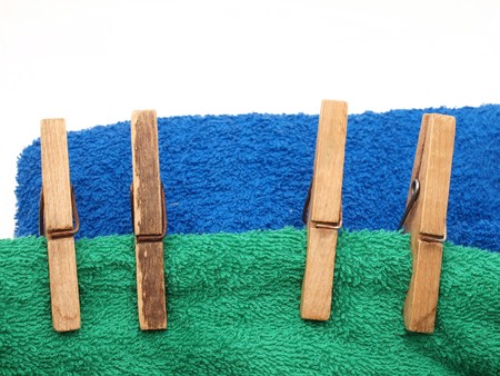 Clothespins on a towel on a white background         