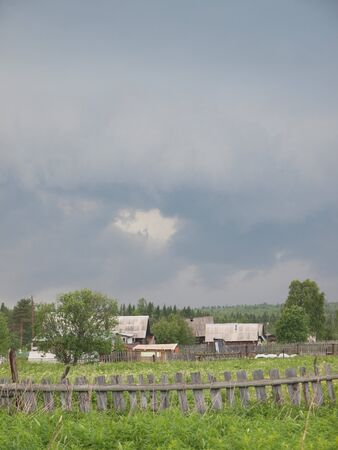 The sky above village in summer. Russia           の写真素材