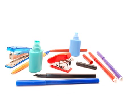 Stapler, the handle and a felt-tip pen on a white background       