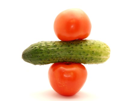 Cucumbers and tomsto on a white background            の写真素材