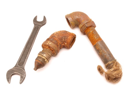 Old a pipe and a wrench on a white background     の写真素材