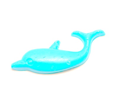 bath soap in the shape of a blue dolphin, isolated on white background の写真素材