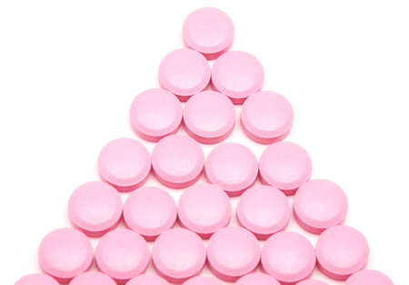Pink tablets on a white backgroundの写真素材