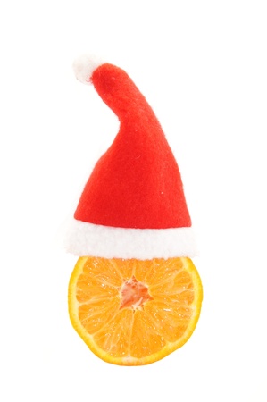 Santa's cap and orange isolated on white backgroundの写真素材