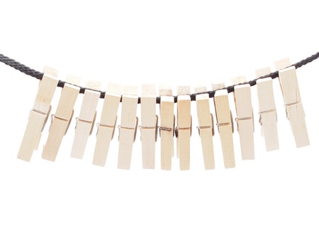 Clothespins and rope on a white background 