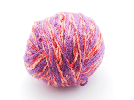 tangle with woolen threads on a white backgroundの写真素材