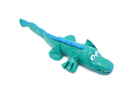 plasticine toy crocodile on a white backgroundの写真素材
