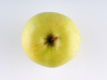 green apple on a gray backgroundの写真素材