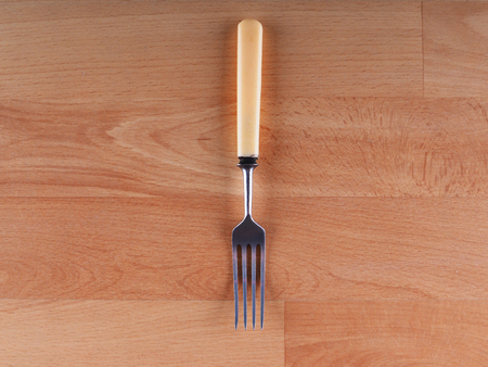 fork on a wooden background