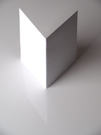 folded paper on a gray background