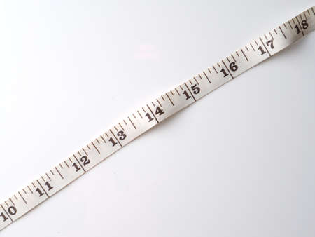 measuring tape on a gray background