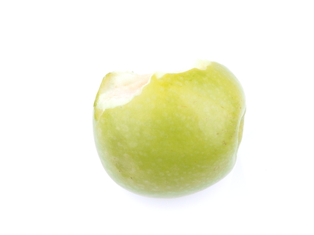 bitten green apple on a white backgroundの写真素材
