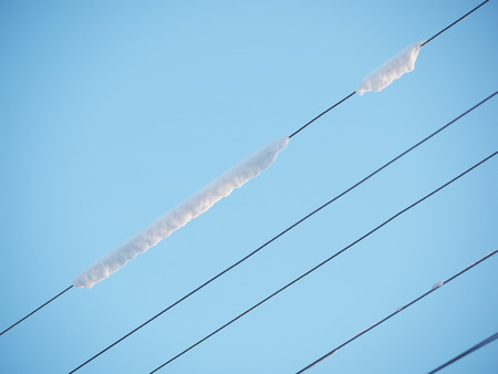 electrical wires in the iceの写真素材