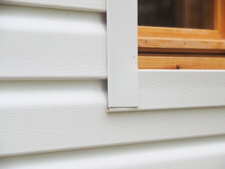 white siding of a frame house