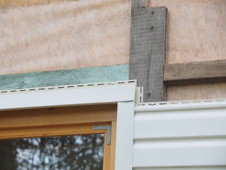 white siding of a frame house