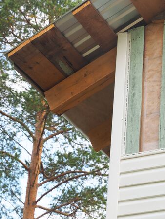 white siding of a frame house