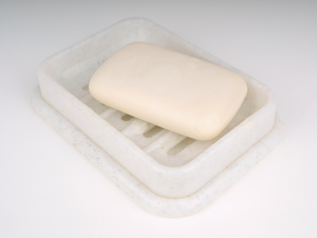soap in the soap dish on a light backgroundの写真素材